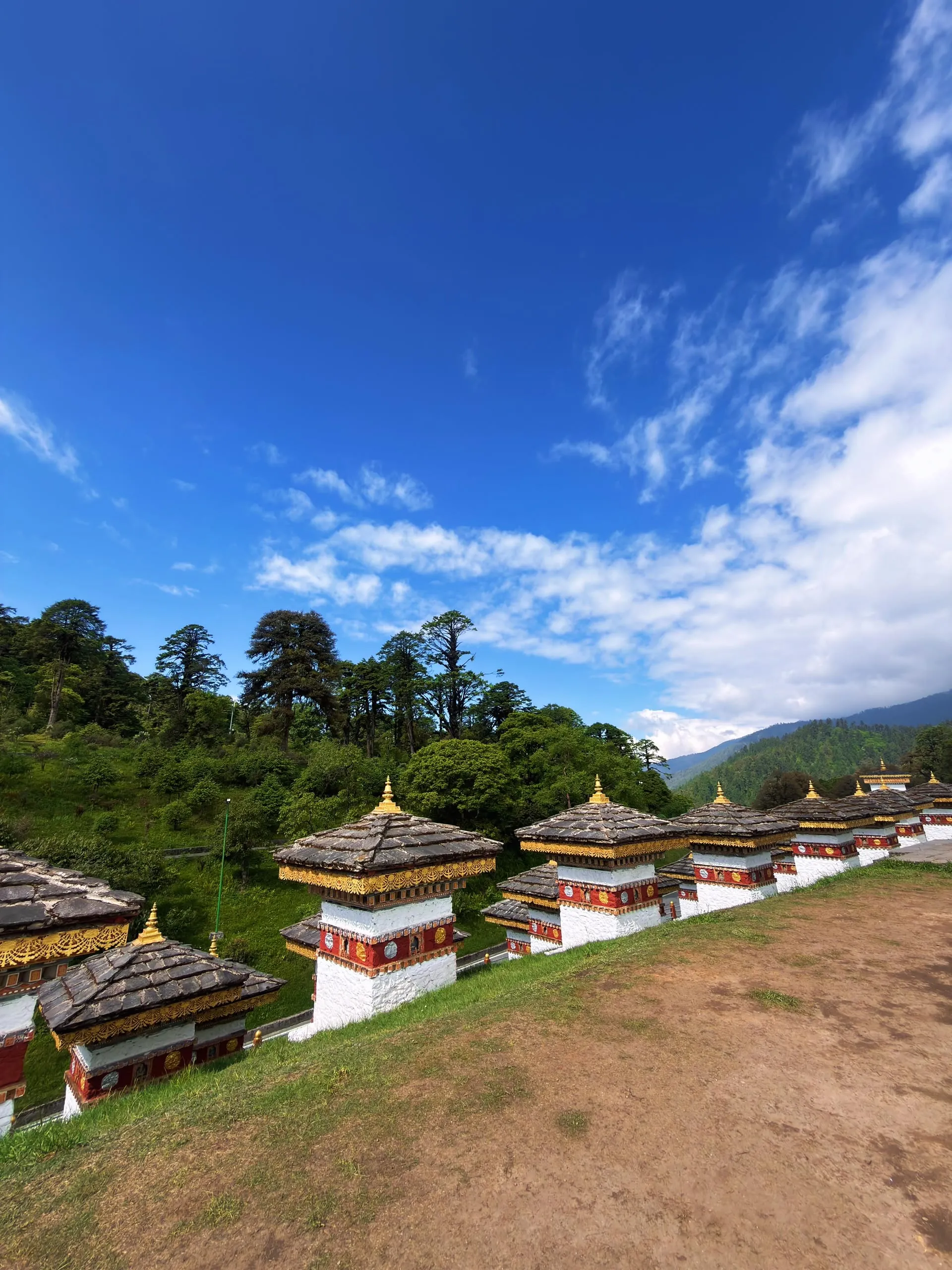 Dochula Pass 108 chortens under a blue Himalayan sky