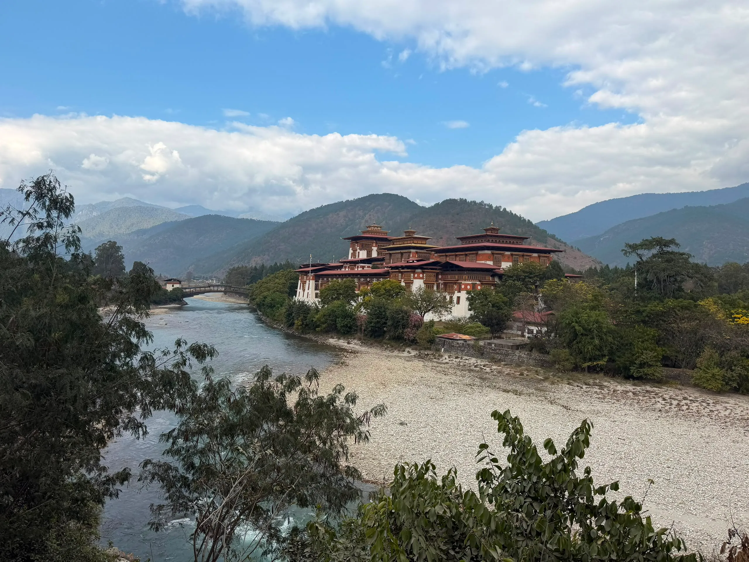 Punakha Dzong above the river with mountains behind