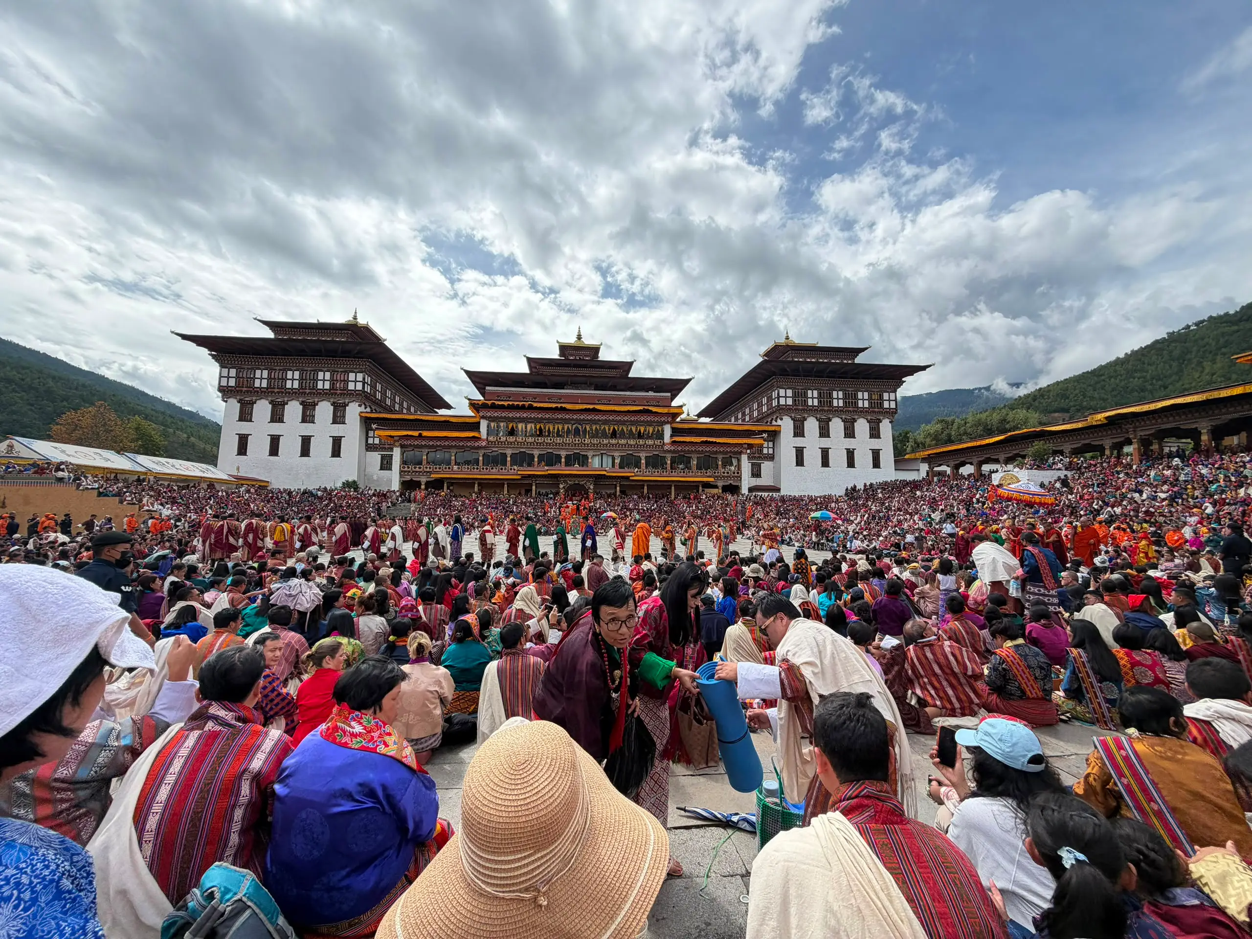 Tashichho Dzong in Thimphu with a large crowd gathered in the courtyard for the tshechu festival