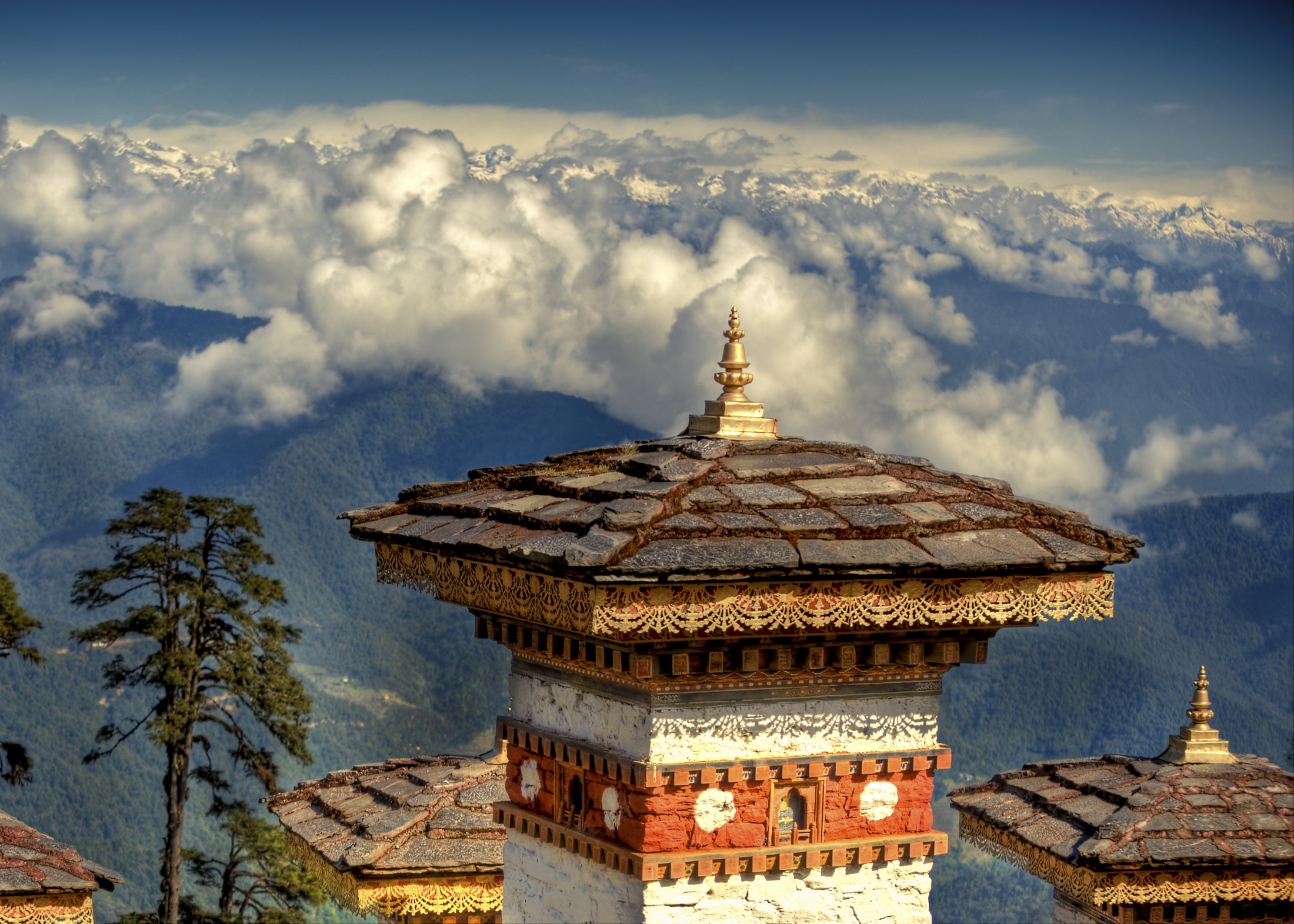 Dochula Pass chorten roof with Himalayan clouds